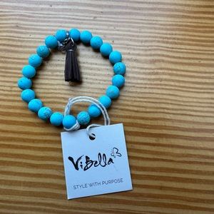 Vibella turquoise beaded stretch bracelet with brown tassel. New never worn.